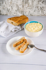 Whole grain baguette made from buckwheat flour and sesame seeds, and salad with egg