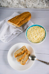Whole grain baguette made from buckwheat flour and sesame seeds, and salad with egg
