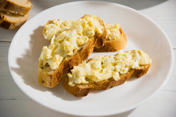 Sandwich with egg and delicious whole grain baguette with sesame seeds. Nutritious breakfast concept