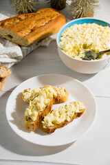 The process of preparing for the Christmas and New Year holidays. Making sandwiches with baguette, processed cheese and egg