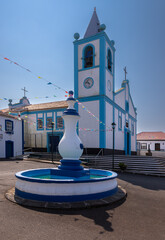 Nossa Senhora do Pilar church in Cinco Ribeiras village, Terceira Island, Azores, Portugal. Traditional Azorean architecture with blue and white facade under clear sky