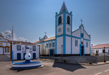 Nossa Senhora do Pilar church in Cinco Ribeiras village, Terceira Island, Azores, Portugal. Traditional Azorean architecture with blue and white facade under clear sky