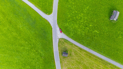 Crossrad in the the middle of meadows, Austria