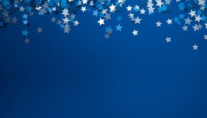 Blue abstract Christmas background or texture with stars confetti on blue background. Space for text