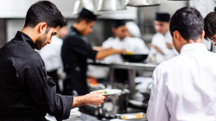 Chefs Working in Restaurant Kitchen