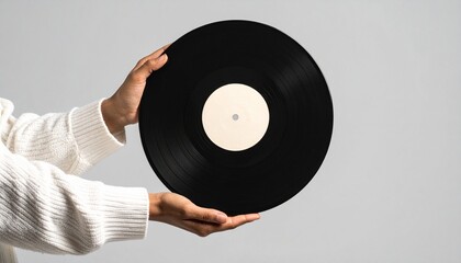 woman holding vinyl record