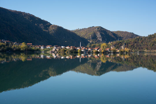 Settlement on Drina river bank near Zvornik, mountain and fortress in background