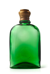 Unique green perfume bottle with a brass cap displayed on a white background. Old fashioned drug bottle for perfume, essential oil, poison, with a cork. Antique green bottle.