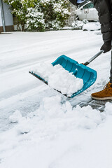 Removing snow from the pathway and street, winter cleaning