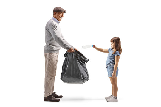 Mature man and a girl collecting plastic bottles in a waste bag