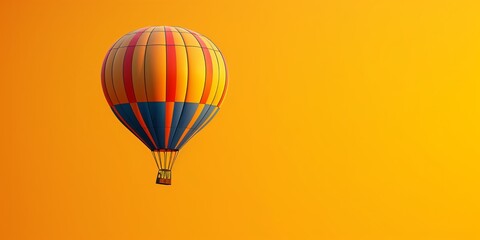 Hot air balloon floats against orange sky during dawn or dusk over an open landscape