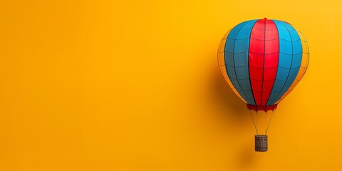 Colorful hot air balloon floats against a bright yellow background showcasing simple design and vibrant colors
