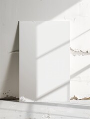 Blank wall with light casting shadows in an empty space during daytime