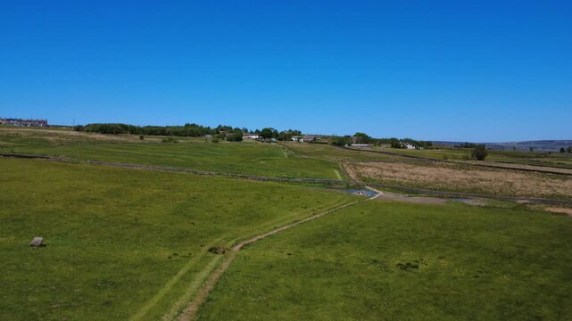 scenic aerial view of west yorkshire calderdale countryside near hebden bridge showing the village of blackshaw head surrounded by meadows in summer