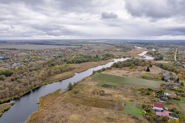 Aerial view of Ros winding river through rural landscape, Ukraine.