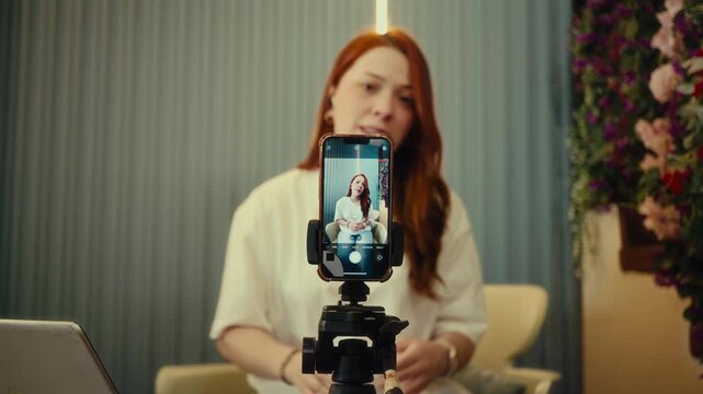 Woman talks to camera and gestures, content creator style