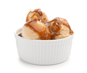 Tasty ice cream with caramel sauce and almonds in bowl isolated on white