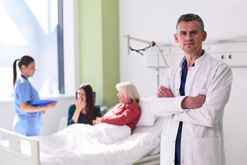 Fototapeta premium Medical professionals assist patients in a hospital room during treatment or recovery in a bright setting