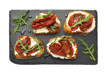 Delicious bruschettas with cream cheese, sun-dried tomatoes and arugula isolated on white, top view