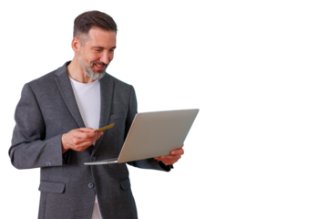 Mature man online shopping from laptop, holding credit card for secure e-commerce payment transaction