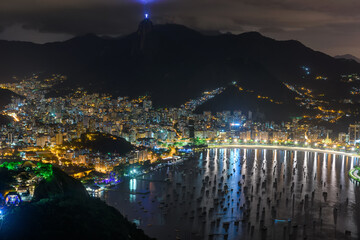Night aerial view of Corcovado, Botafogo and Guanabara bay in Rio de Janeiro, Brazil. Skyline of Rio de Janeiro.
