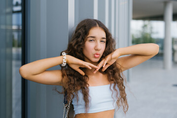 Trendy Teenager With Pouting Lips Outdoors