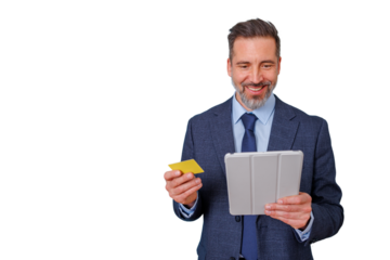 Businessman smiling, holding a gold credit card and a digital tablet, enjoying a secure online shopping experience