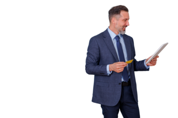 Mature businessman holding tablet and credit card, online shopping and digital payment, e-commerce concept