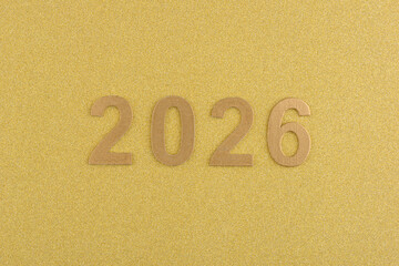 Números de año nuevo de 2026 sobre fondo dorado