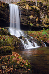 Side view of scenic Skok waterfall on Old Mountain during autumn season