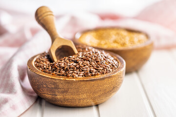 Linseed or flaxseed. Healthy flax seed in bowl on white table.
