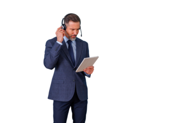 Businessman wearing headset holding digital tablet and adjusting earpiece, working in customer support, transparent background