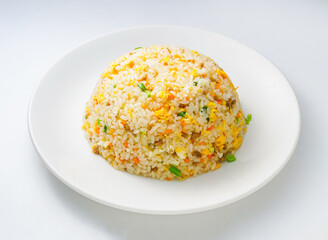 Delicious fried rice dish on a white plate ready to eat