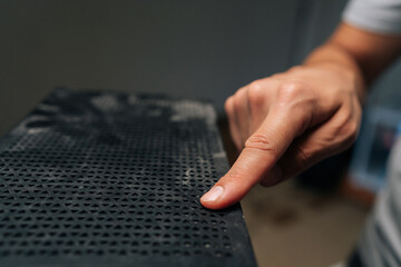 Computer technician checking dust accumulation on desktop case, preventing potential overheating and maintaining system performance with careful cleaning process. Concept of service, cleaning PC.