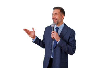 Mature man speaking into a microphone, gesturing with his hand. He is wearing a suit and smiling. Transparent background