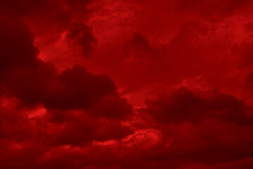 Red cloud texture background. Blurred photo of red sky with clouds. Photo can be used for galaxy space, New Year, Christmas and all celebrations backgrounds.