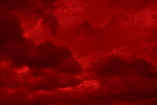 Red cloud texture background. Blurred photo of red sky with clouds. Photo can be used for galaxy space, New Year, Christmas and all celebrations backgrounds.