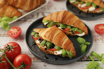 Croissants with mozarella cheese and tomatoes in caprese style