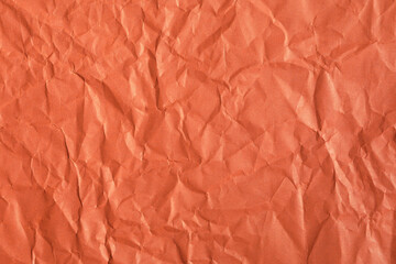 Crumpled red paper texture with macro detail