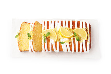 Fototapeta premium Delicious lemon cake with glaze, fresh fruit slices and mint isolated on white, top view