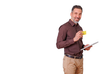 Man smiling, holding a generic credit card and tablet, making an online purchase. Transparent background