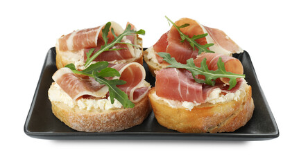 Delicious bruschettas with cream cheese, prosciutto and arugula isolated on white