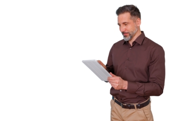 Mature businessman using digital tablet, focused on mobile technology, enjoying smart device and portable touchscreen working with finance