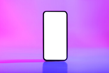 This scene features a modern smartphone displaying a blank white screen. The device is illuminated by vibrant neon lighting, creating an ideal setting for app or website design mockups.