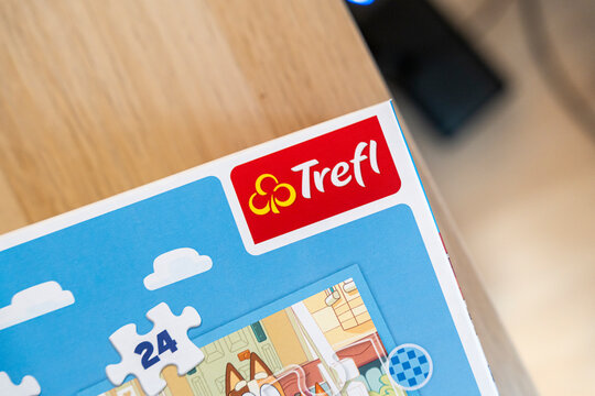 Warsaw, Poland - Dec 16, 2025: Puzzle box featuring the Trefl brand, showcasing a vibrant design with cartoonish illustrations. Ideal for family activities or educational purposes.