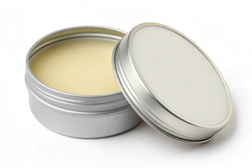 Round lip balm tin with removable lid and smooth moisturizing balm inside on white background. This round lip balm tin represents skincare convenience and personal care.
