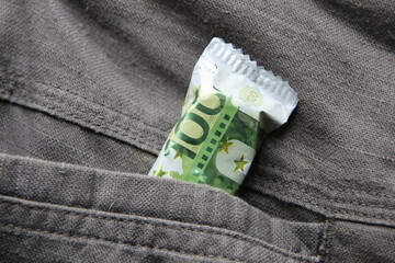 Euro in a jeans pocket. Money for travel and shopping
