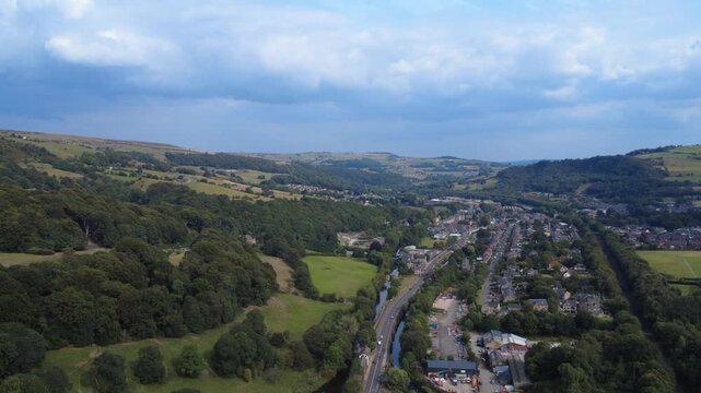 scenic aerial view of the village of mytholmroyd in the calder valley showing the river main road and rochdale canal