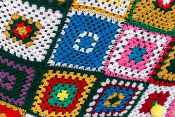 Handmade colorful crochet granny square blanket texture