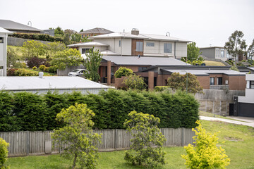 Elevated suburban view of modern residential houses in Geelong, Victoria, Australia. Contemporary living, medium-density housing, and the layered landscape of established neighborhoods